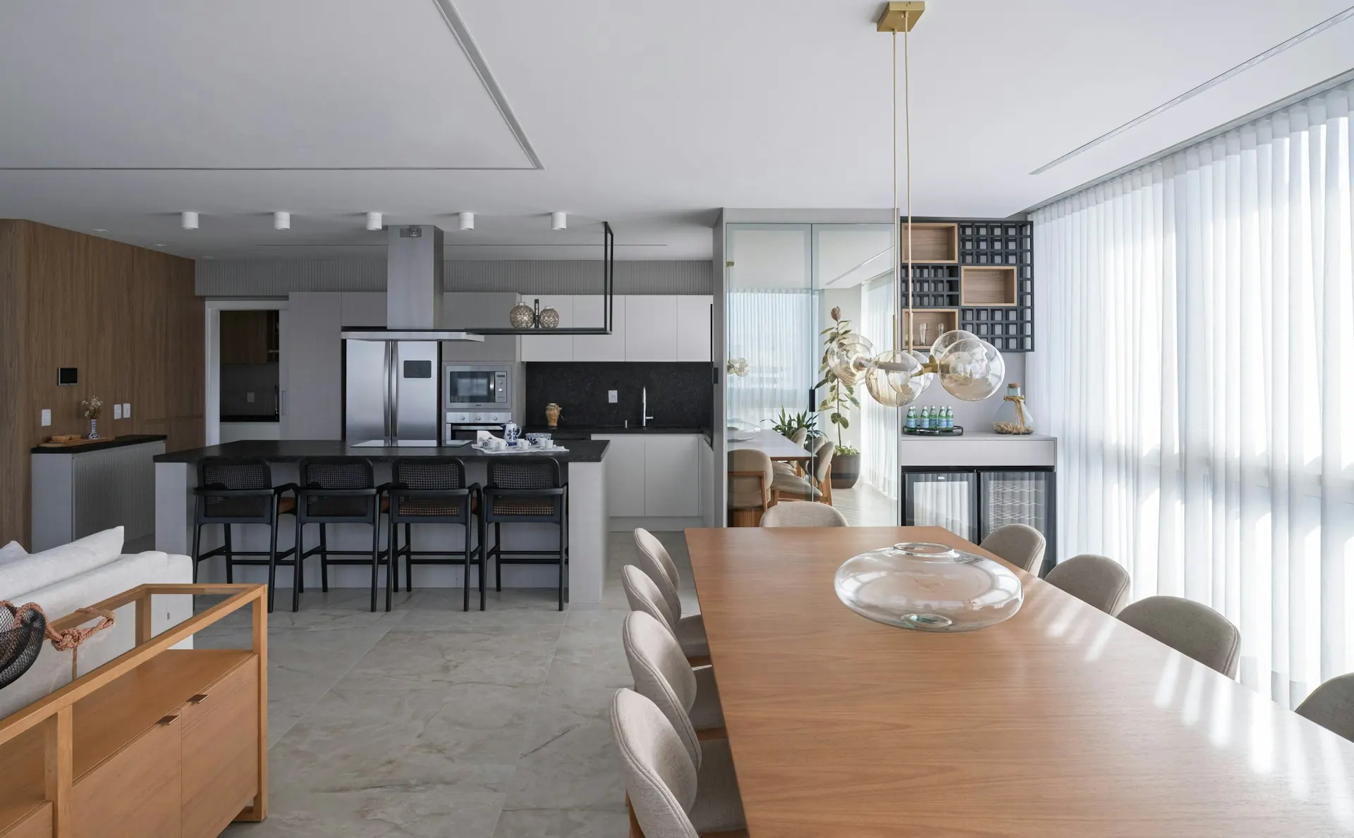Modern open-plan kitchen and dining room — kitchen connected to living area