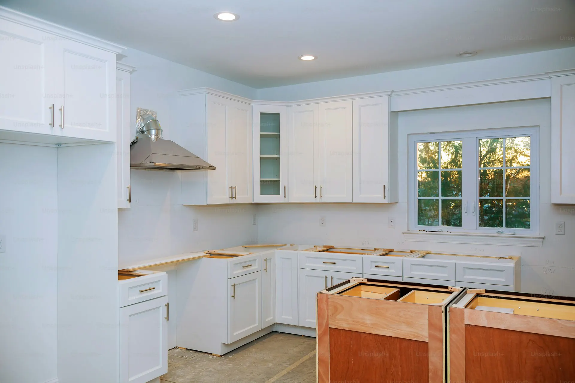 Custom kitchen cabinets in various stages of installation — illustrating the cabinet style options across Bergen County housing categories